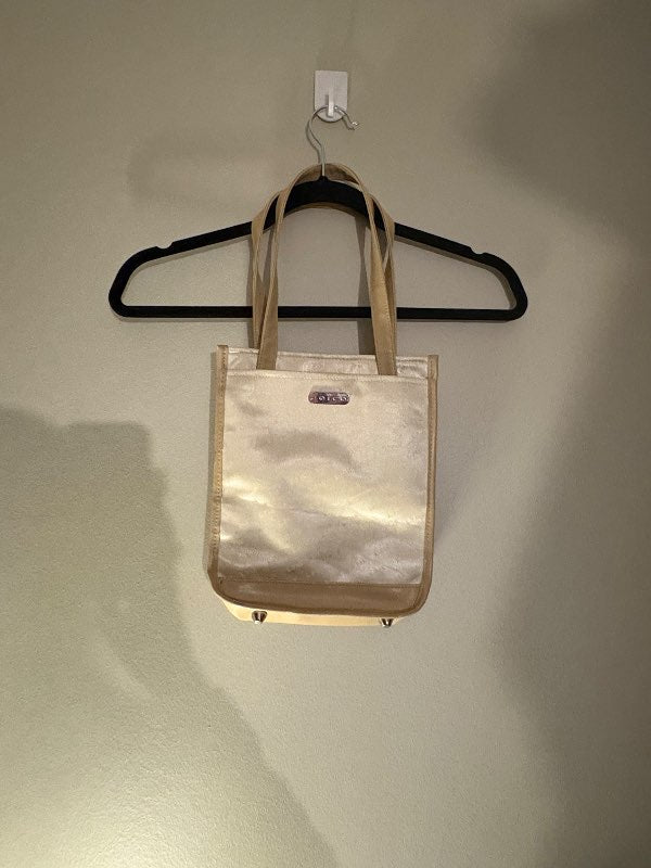 beige nestistaska