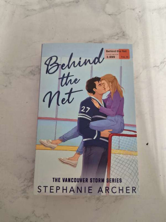 Behind the net
