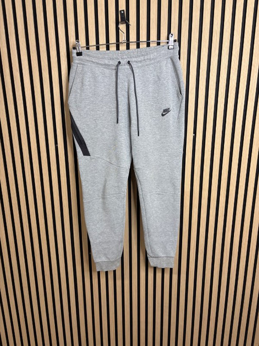 Nike fleece teck buxur