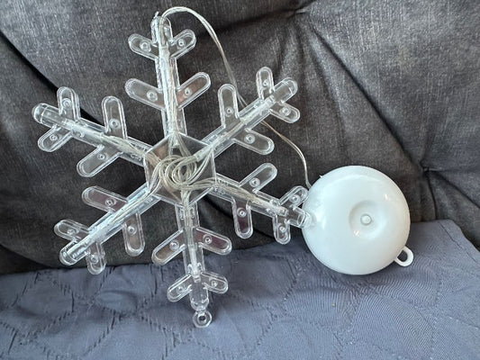 Snjókorn ljós í glugga